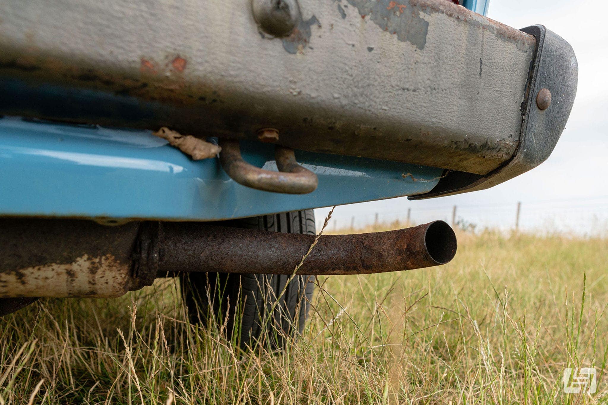 Close up of VW T3 exhaust tailpipe and rear bumper with towing eye