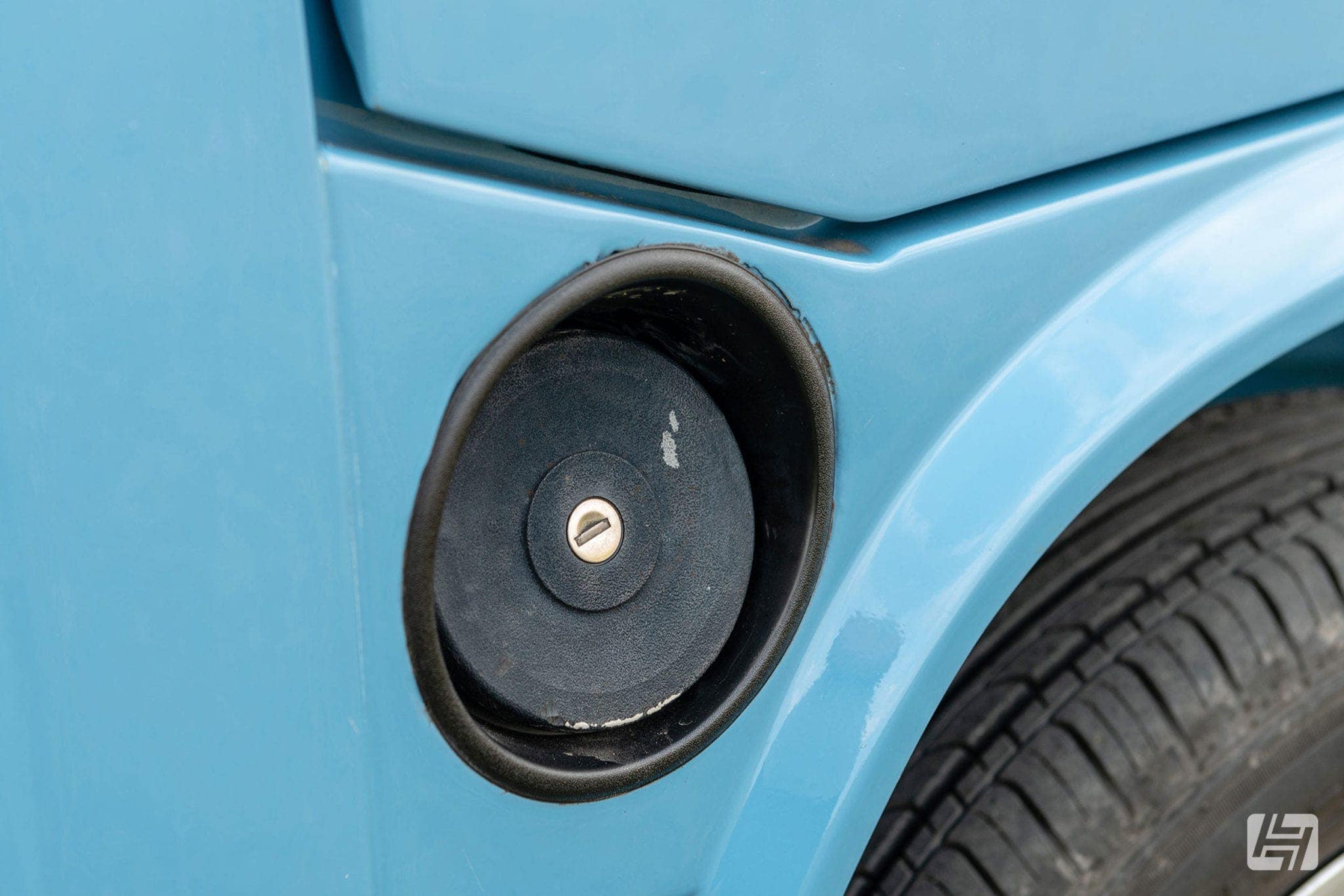 Close up of lockable fuel filler cap on blue VW T25