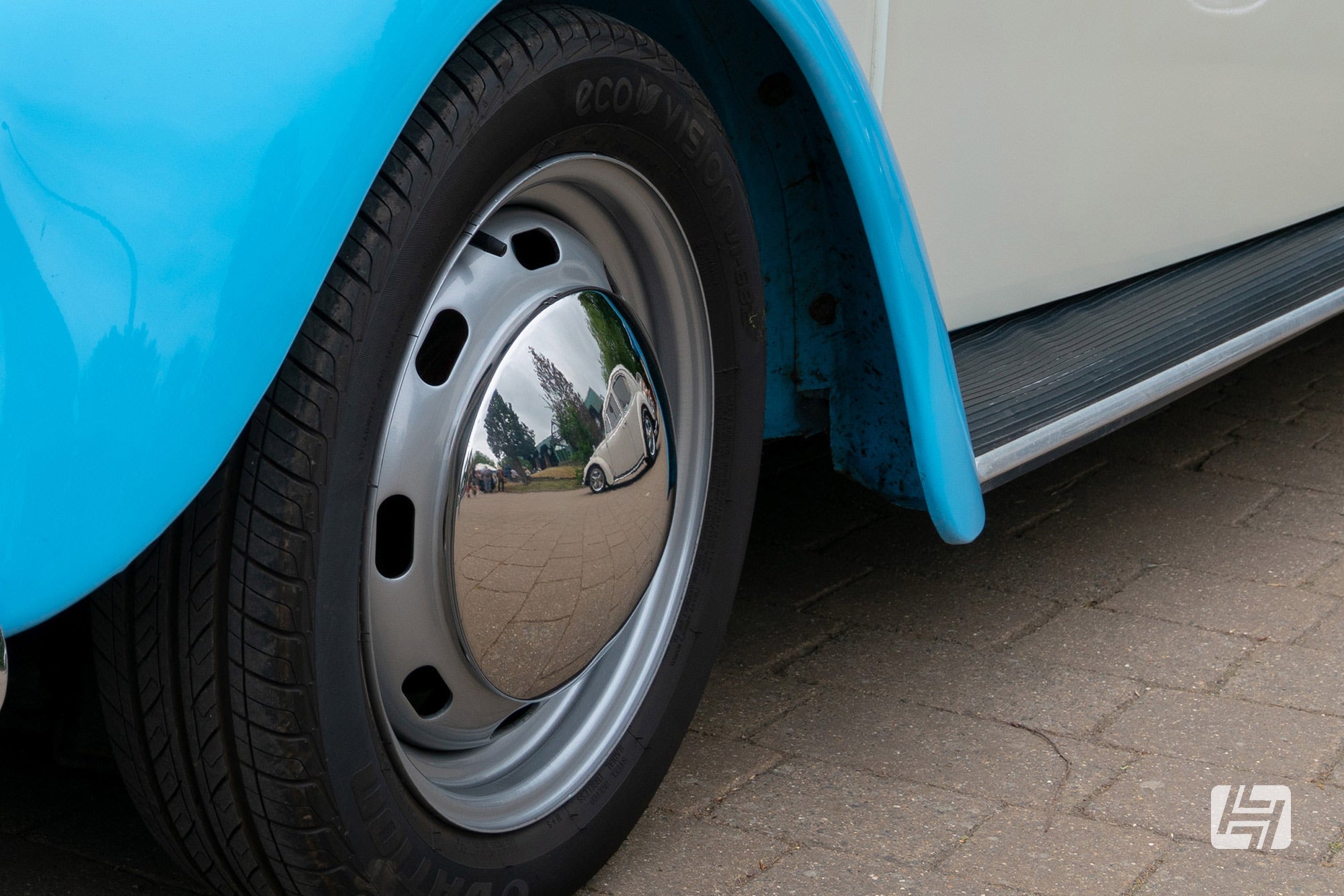 Blue VW beetle with steel wheels and domed baby moon hubcaps