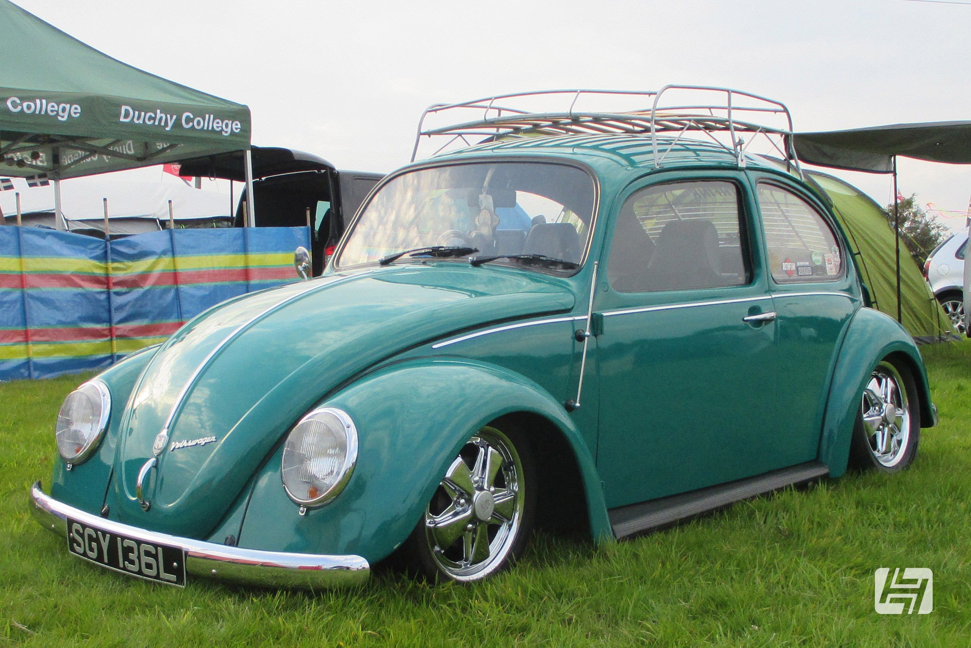 Java Green VW Beetle with early long bonnet and blade bumpers fitted with chrome fuchs style wheels