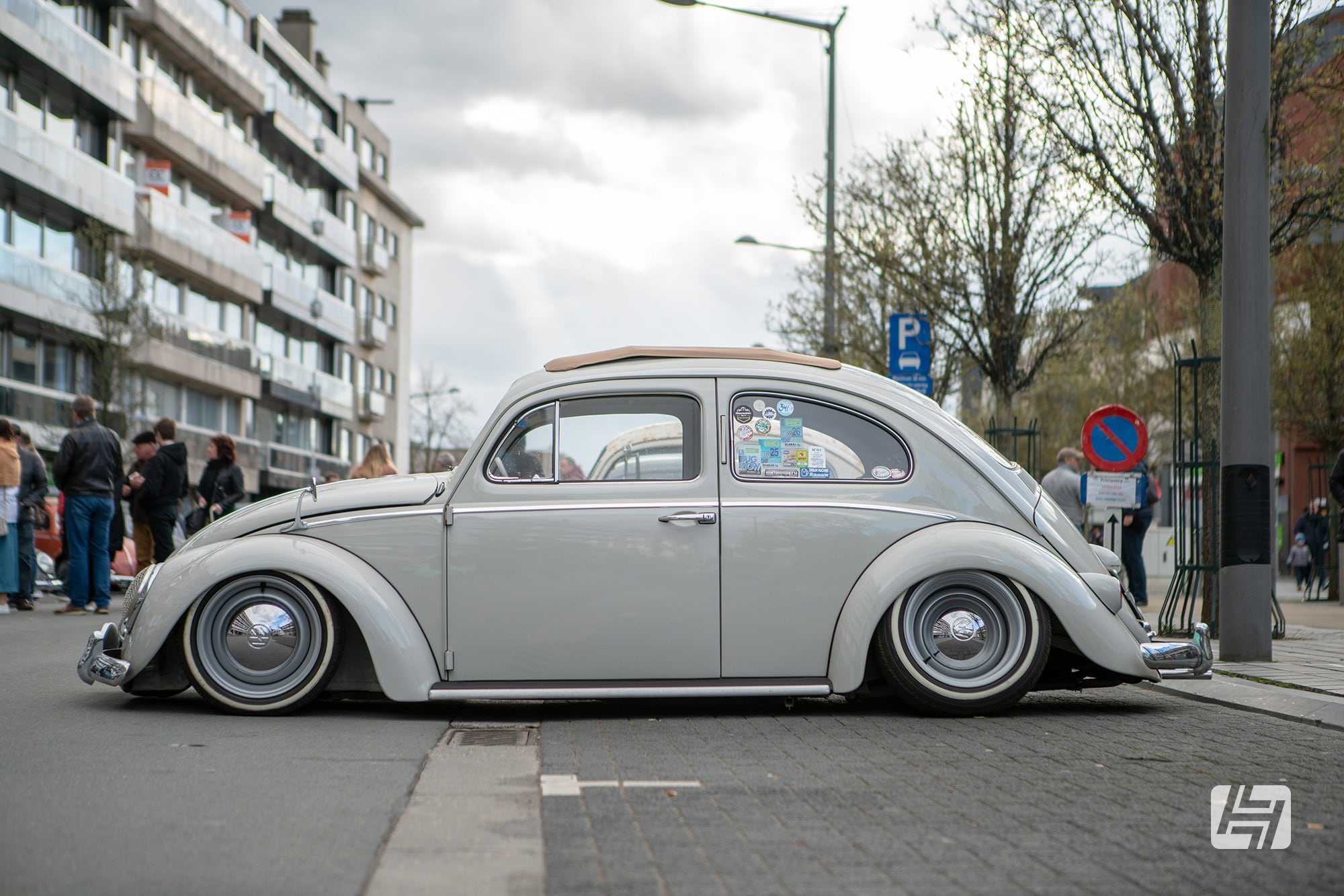 Early style White VW Beetle with ragtop sunroof side profile