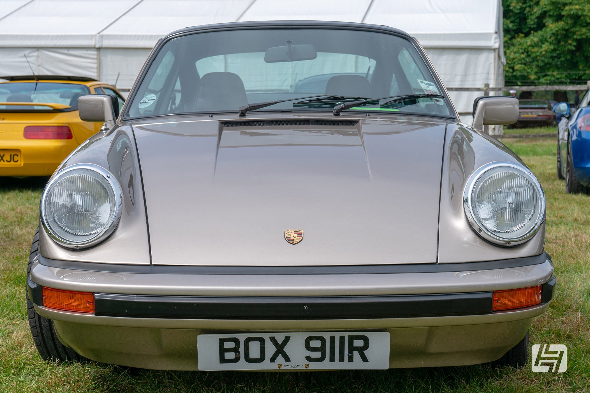 Front end of gold Porsche 911 G body car