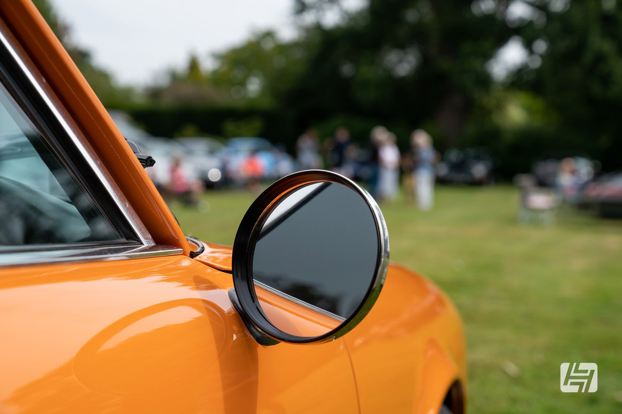 Durant style mirror fitted to orange classic Porsche 911